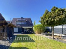 Gartenansicht - Einfamilienhaus in Braunschweig Gliesmarode mit Garten Familienidylle in Braunschweig-Ost: Klein, charmant und energetisch top saniert (Energiebedarf A)
